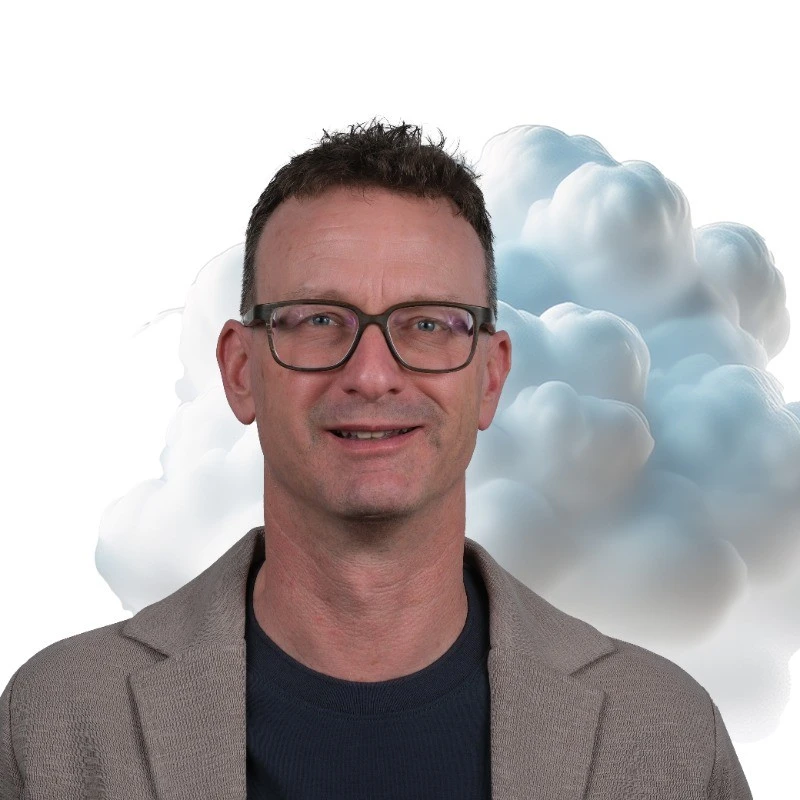 Evora team member portrait of Beat Wyler with cloud imagery representing digital transformation and cloud solutions.